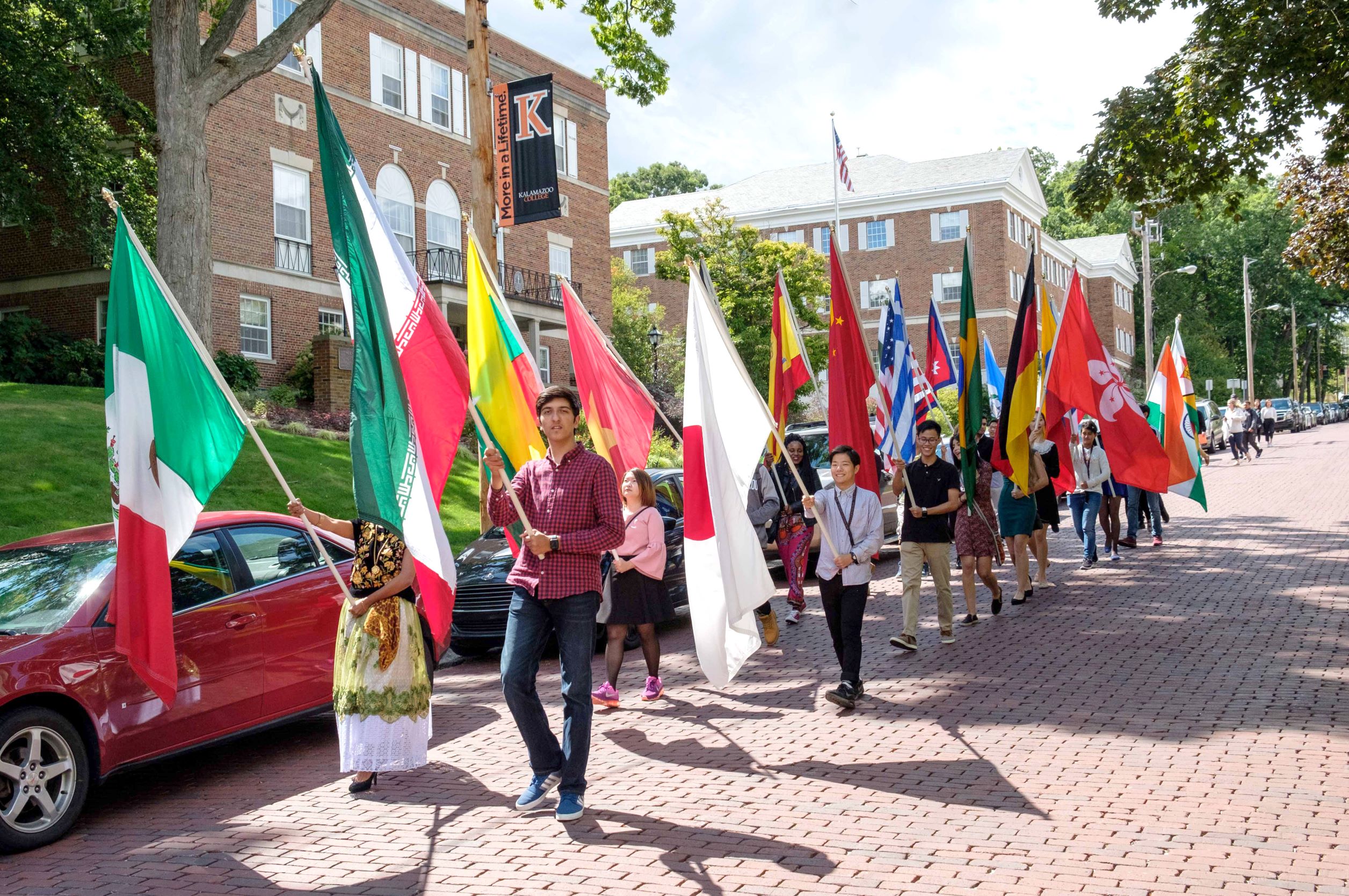 international students holding their respective flags