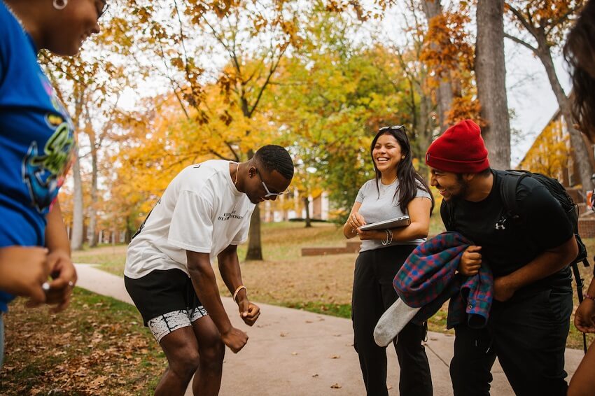 Students laughing and dancing