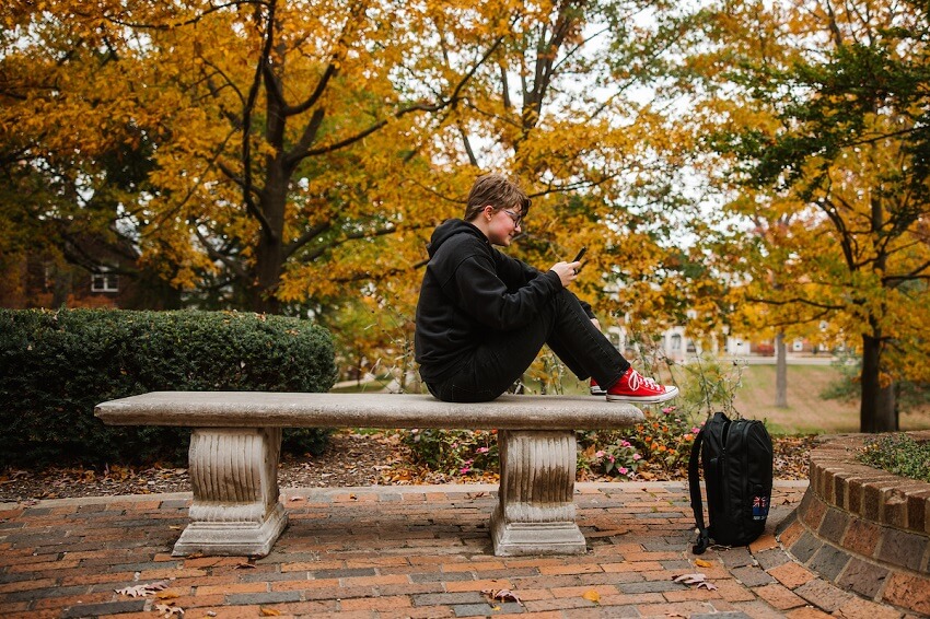 A student sitting on a bench