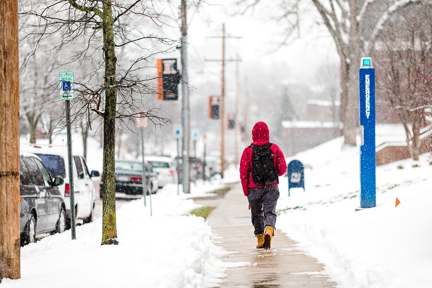K student walking in the snow