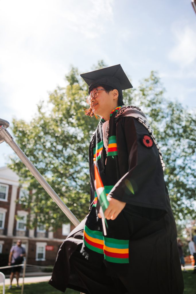 Male student in graduation cap and gown